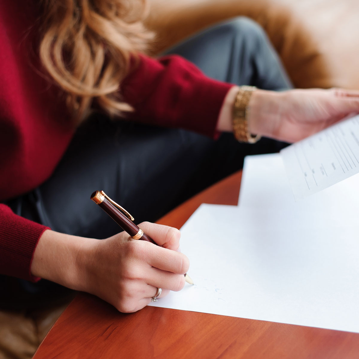 young-businesswoman-working-with-papers-close-up-1-1